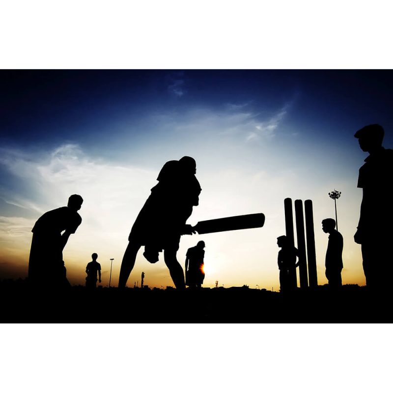 SG1979 boys playing cricket evening silhouette