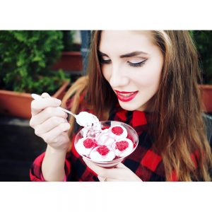 SG2817 woman eating dessert raspberries cream