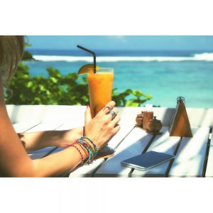 SG2871 girl drinking healthy juice beach
